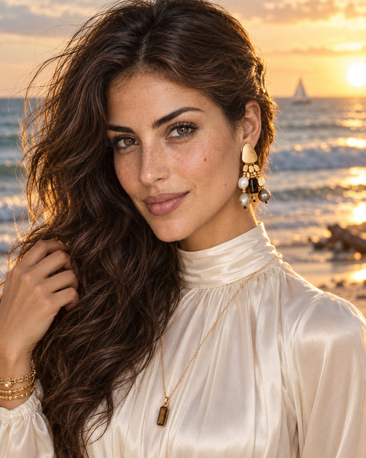 Golden tide mixed tassel earrings worn by model beach sunset